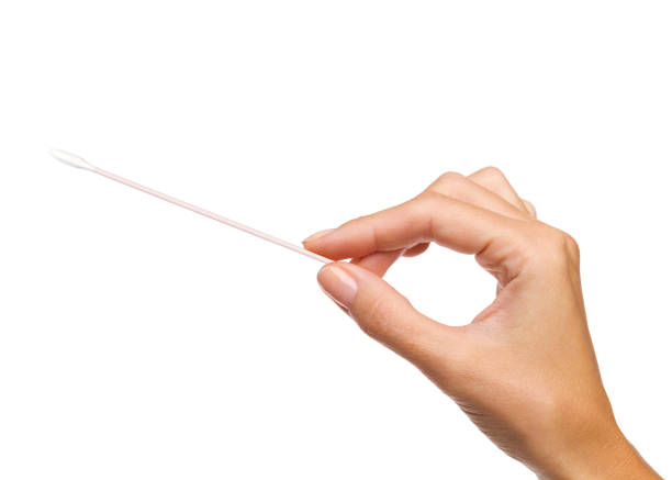 istock Hand holding COVID-19 swab. 1292875975