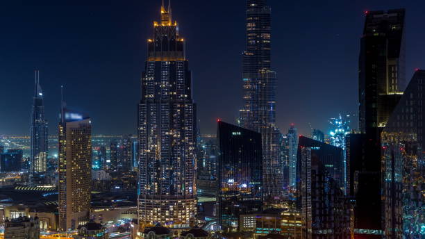 istock Dubai downtown skyline night with tallest building and Sheikh Zayed road traffic, UAE 1292876390