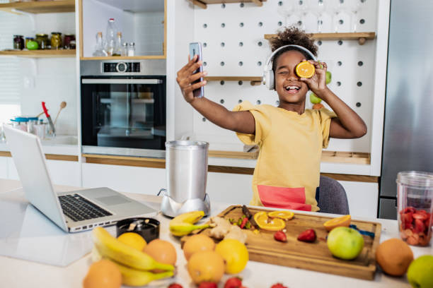 istock Young girl having fun in the kitchen 1292876429