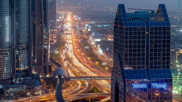 istock Dubai downtown skyline day to night and Sheikh Zayed road traffic, UAE 1292877429