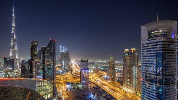 istock Dubai downtown skyline night with tallest building and Sheikh Zayed road traffic, UAE 1292877704