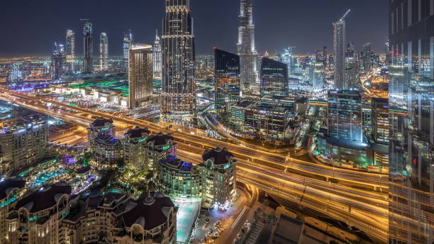 istock Dubai downtown skyline night with tallest building and road traffic, UAE 1292878541