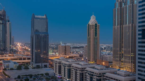 istock Dubai downtown skyline night to day and Sheikh Zayed road traffic, UAE 1292879797