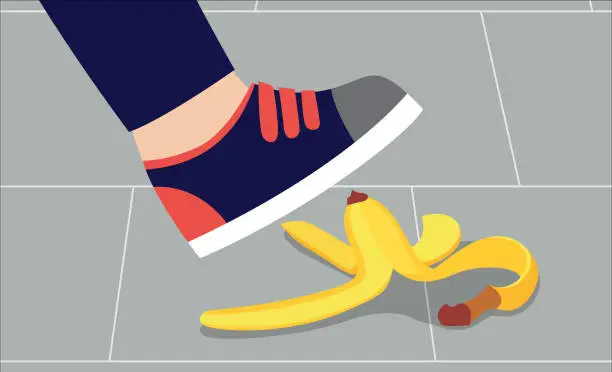 Vector illustration of Foot in shoe about to step on banana peel - cartoon person in sneakers