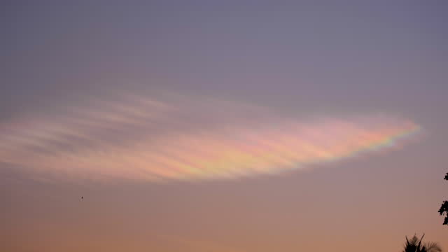 Rainbow clouds in the evening sky.
