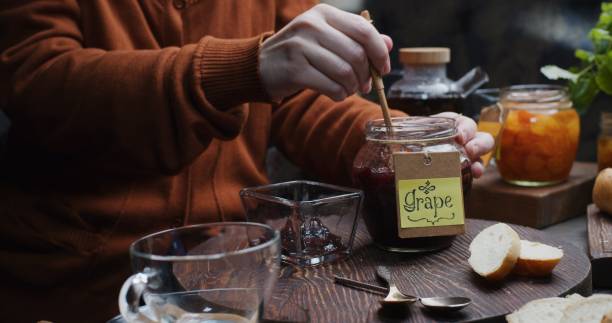 istock Making a toast with homemade jam for breakfast 1292882978