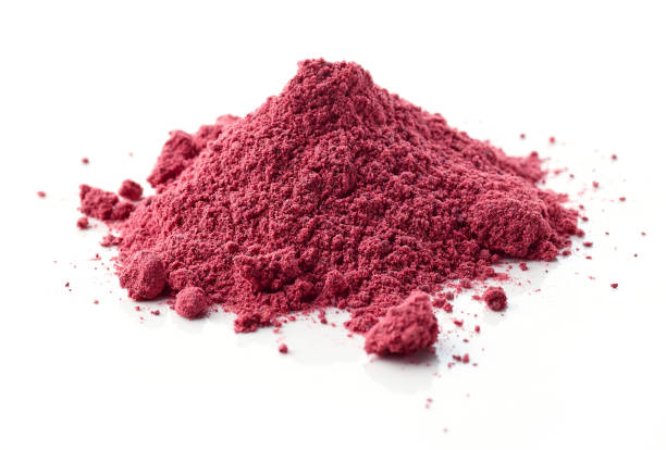 istock heap of dried beet root powder macro isolated on white background, selective focus 1292884798