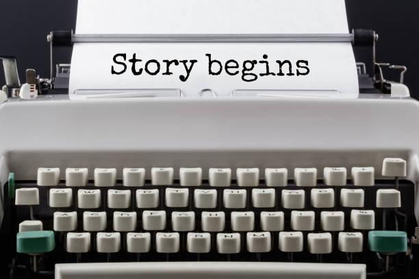 Text STORY BEGINS typed on typewriter, close up.