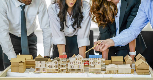 istock architecture business background of diverse project development architect team have brainstorming for residential project work with project architecture model on table in architecture office 1292887279