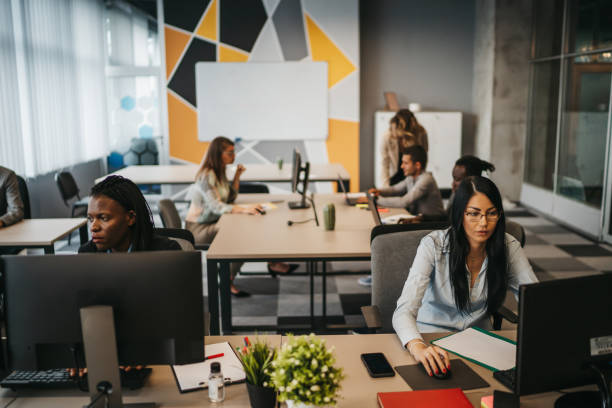 istock Young business people working in modern office 1292887357
