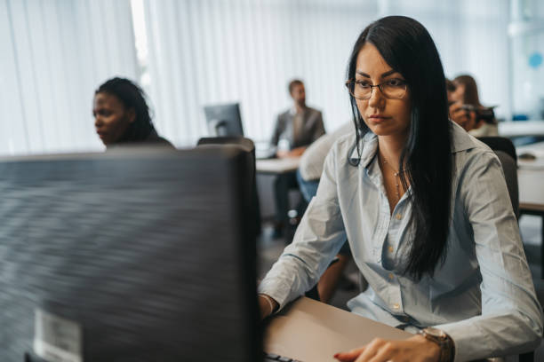 istock Young business people working in modern office 1292888023
