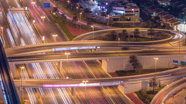 istock Night traffic on a busy intersection on Sheikh Zayed road highway aerial timelapse 1292889052