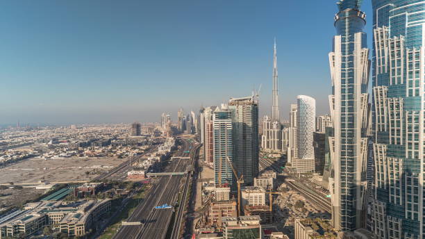 istock Sunset skyline with modern skyscrapers and traffic on sheikh zayed road timelapse in Dubai, UAE 1292889089