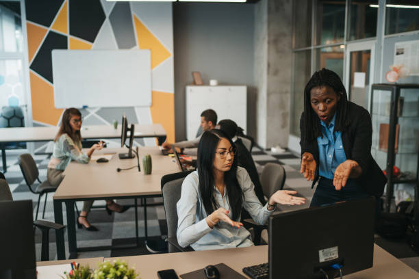 istock Manager supervising the work of employees 1292889443