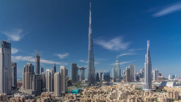 istock Dubai Downtown skyline timelapse with Burj Khalifa and other towers paniramic view from the top in Dubai 1292889518