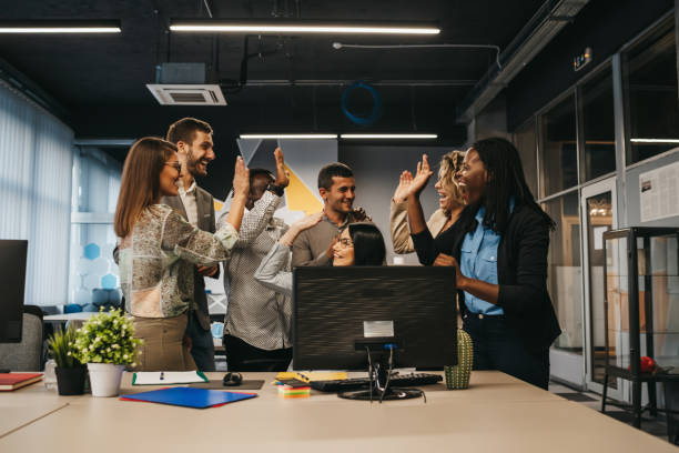 istock Happy multinational coworkers giving high five celebrating great teamwork result 1292890364