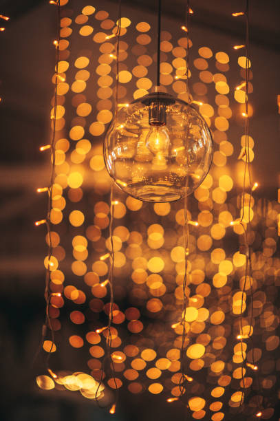 istock Celebratory Warm String Fairy Lights Bokeh Defocussed with Copy Space with Modern Bulb 1292895052