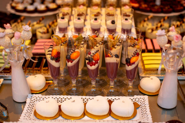 istock candy bar with delicious sweets : macaroons, cupcakes, cakes and cake pops 1292896529