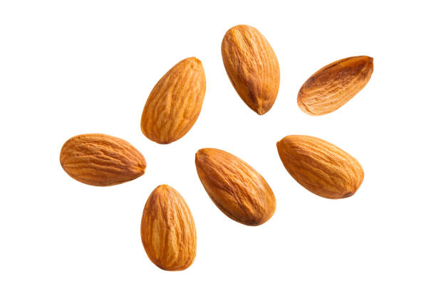 istock almond nut Beautiful floating healthy food white isolated 1292899093