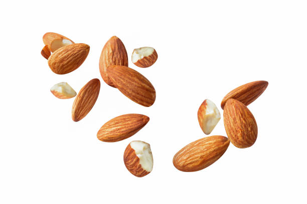 istock piece side view  almond cracked macro on white isolated 1292899219