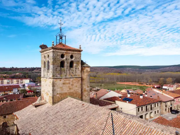 Aerial view of a bell tower of theChurch of Santa Maria with her stork's nest in the village Salas de los Infantes, Burgos Spain.