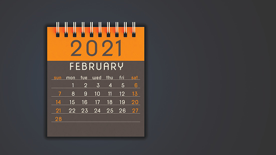 Stylized 2021 calendar notebook February page in orange, front view with copy space