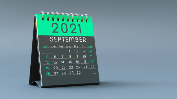 istock 2021 calendar notebook with September page in green colors, standing on a light gray background 1292900759