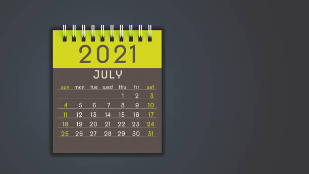 istock Stylized 2021 calendar notebook July page in yellow, front view with copy space 1292900805