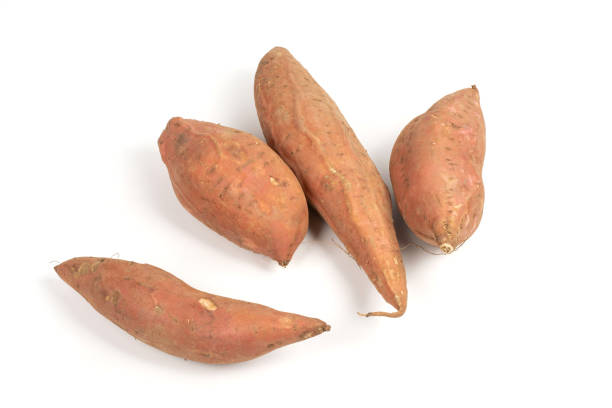 istock Raw Sweet Potato on White Background 1292901983