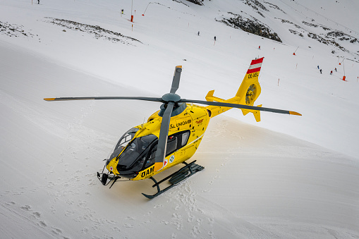 Hintertux, Austria - February 25.02.2020: Just landed rescue helicopter in winter landscape at Hintertux glacier in Zillertal.
