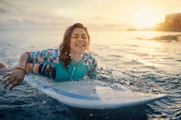 istock Woman Paddling With Surfboard. 1292903493