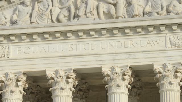 Close up of 'Equal Justice Under Law' engraved on West Pediment of US Supreme Court - D.C.