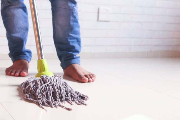 istock cleaning tiles floor with mop 1292905714