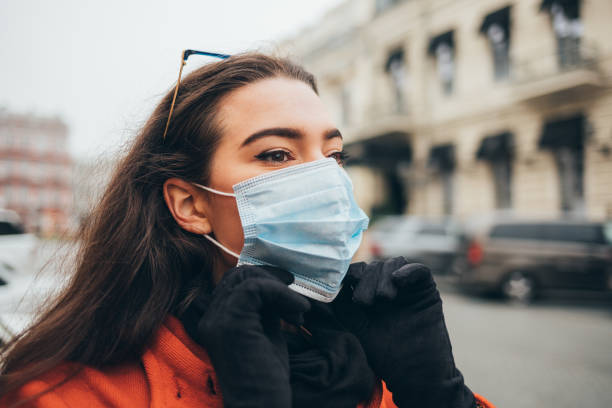 istock Young woman wears a medical mask 1292906021