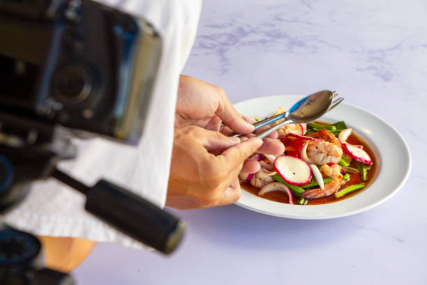 istock Thai spicy salad with shrimp on a white table in a restaurant. 1292911666