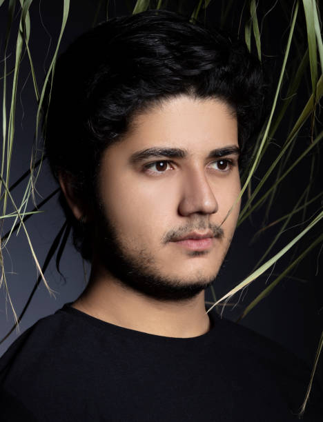istock Portrait of young handsome young man in studio. 1292911727