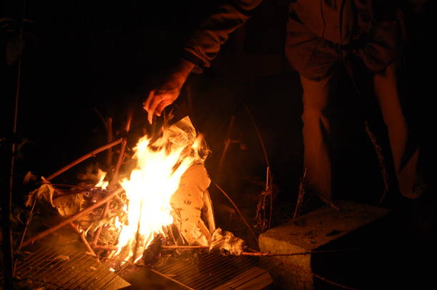 istock A young man is lighting a winter solstice bonfire up on the 21. december. 1292911738