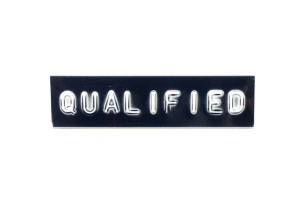 istock Embossed letter in word qualified on black banner with white background 1292915790