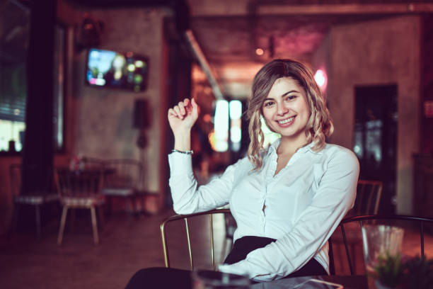 istock Smiling Female Beauty Relaxing In Coffee Bar 1292919208