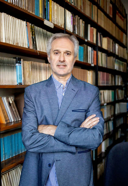istock University professor in library stock photo 1292930155