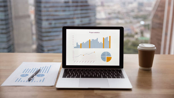 istock Banner view of empty office workplace with laptop 1292931089