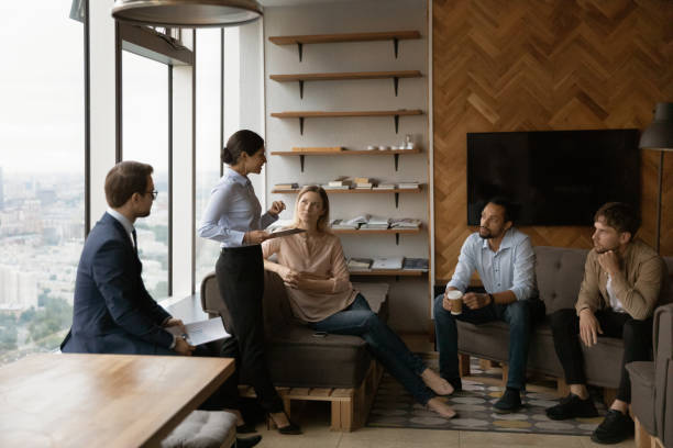 istock Diverse colleagues cooperate at team meeting in office 1292931129