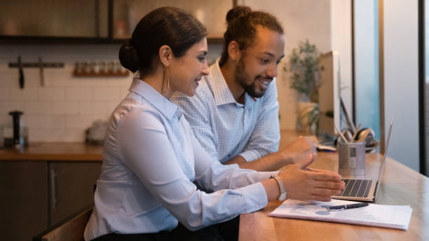 istock Banner view of multiracial colleagues work on laptop 1292931146