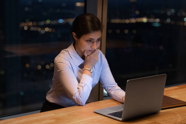 istock Pensive Indian female employee work in office late 1292931158