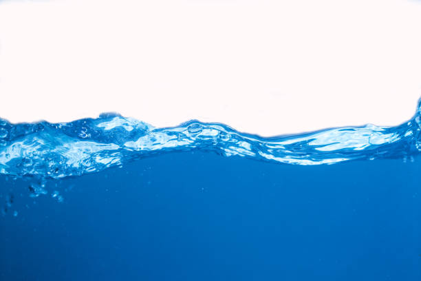 istock Water splash. Aqua flowing in waves and creating bubbles. Drops on the water surface feel fresh and clean. isolated on white background 1292933205