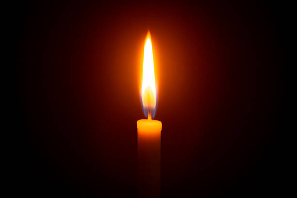 istock Candle light on black background ,Candle, Flame, Black Background, Candlelight, Single Object,Single lit candle with quite flame ,Candle, Flame, Fire - Natural Phenomenon, Copy Space, Candlelight 1292933244