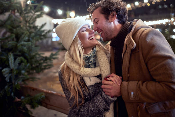 istock Happy couple choosing a Christmas tree together 1292933247