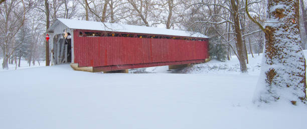 istock Red Covered bridge in the snow-Howard County Indiana 1292935046