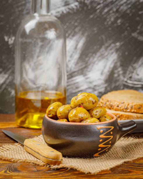istock Still life with marinated olives in a bowl 1292935590
