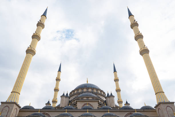 istock Beautiful mosque on the background of the cloudy sky 1292936558